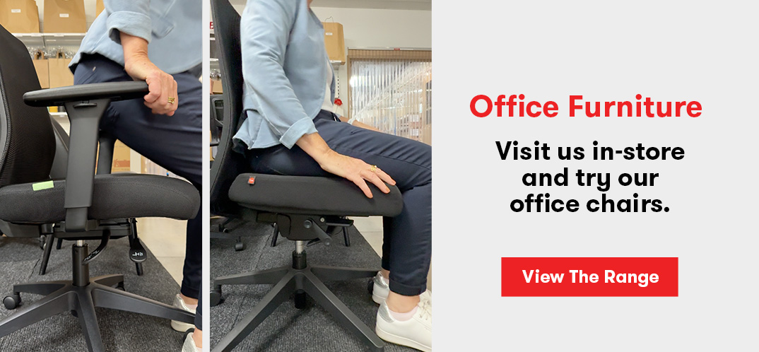 Person trying out an office chair for comfort